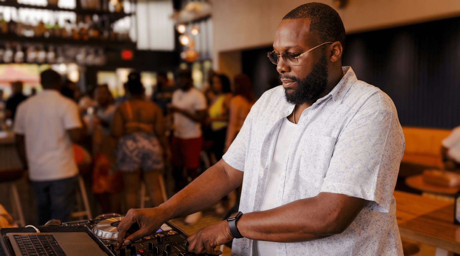 DJ Impeccable performing at a crowded event